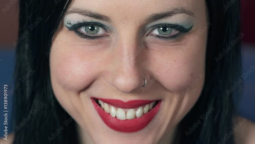 beautiful woman with blue eyes smiling at the camera beautiful woman with blue eyes smiling at the camera