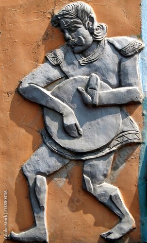  Wall art of Indian tribal drummer performing in events,festivals and celebrations as in rural areas 