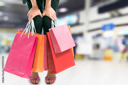 soft focus women holding shopping bags in her hand with blurred background