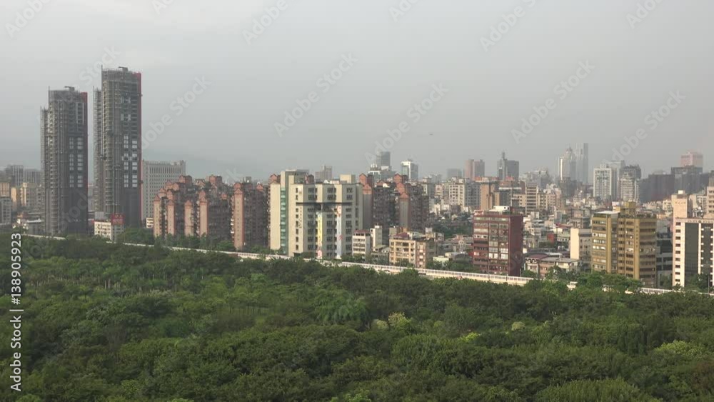 Taiwan skyline with the famed Taipei 101 skyscraper, it is cloudy and there is a small rainbow 4k Taiwan skyline with the famed Taipei 101 skyscraper, it is cloudy and there is a small rainbow 4k