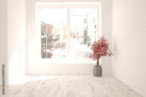 White empty room with red flower and winter landscape in window. Scandinavian interior design