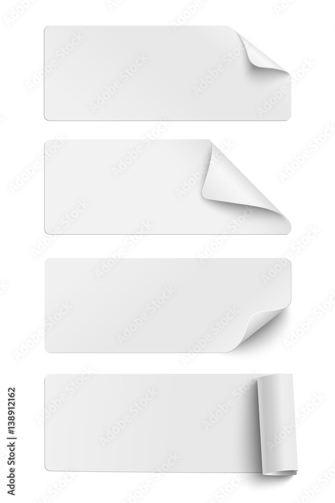 Set of oblong white sticky paper pieces. One piece has rolled end and others have curled corners  with shadow isolated on white background
