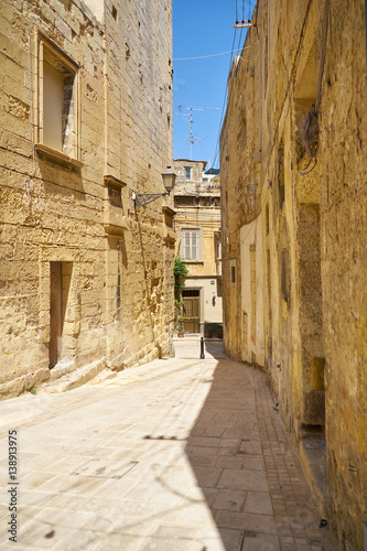 Fototapeta Naklejka Na Ścianę i Meble -  The narrow street of the old capital Vittoriosa (Birgu), Malta