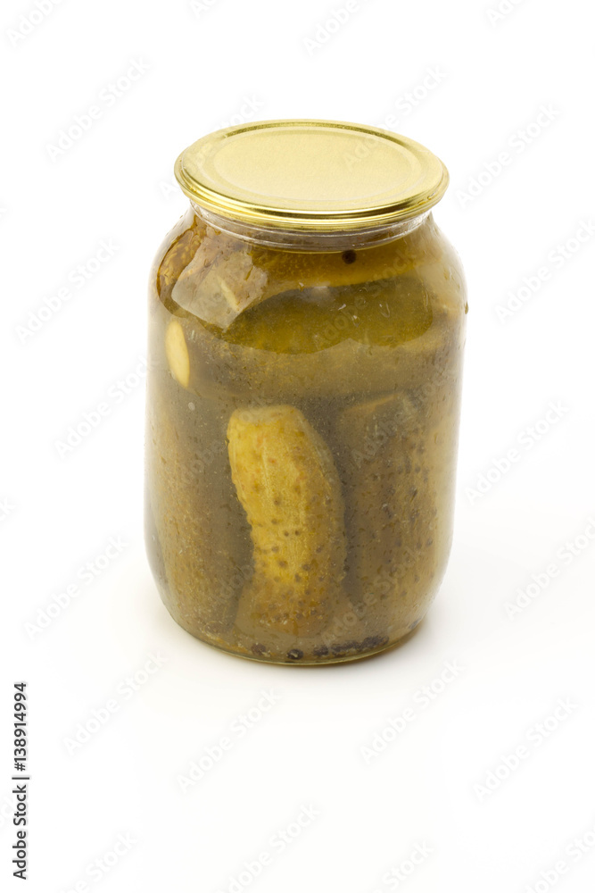Pickled cucumbers in jar isolated on white background