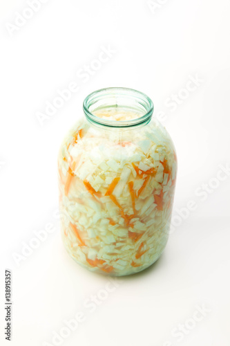 Sour cabbage in a glass jar isolated on white background