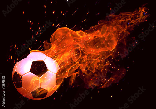 Image of soccer ball in fire flames against black background