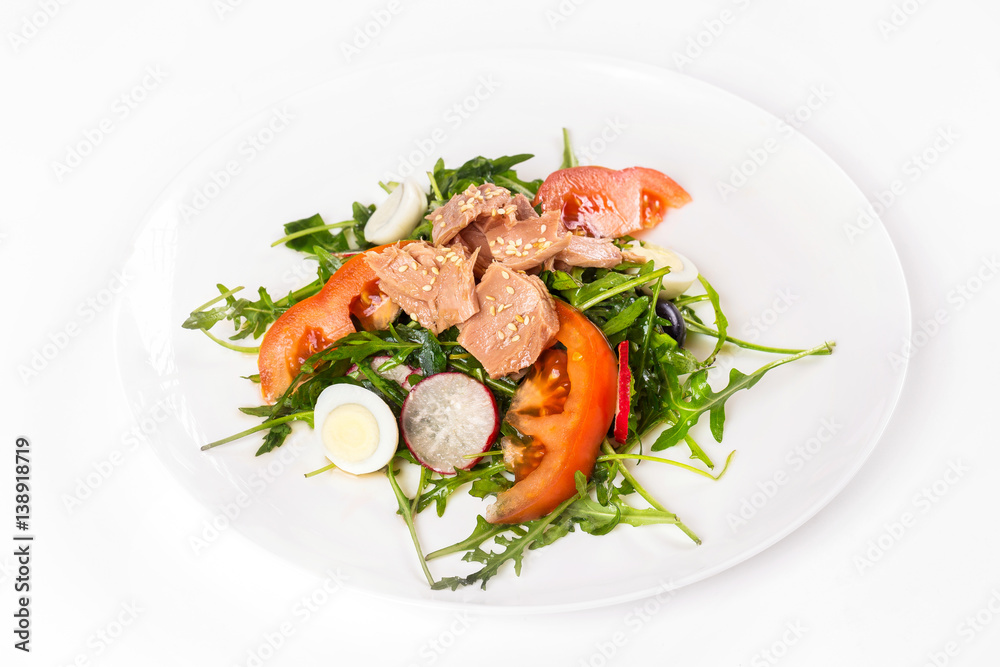 Plate of tuna salad with fresh vegetables isolated at white background. Plate of tuna salad with fresh vegetables isolated at white background.