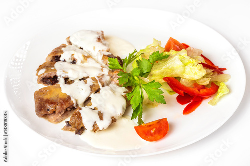 Plate of vegetables and meal of minced meat with mushrooms isolated at white background.