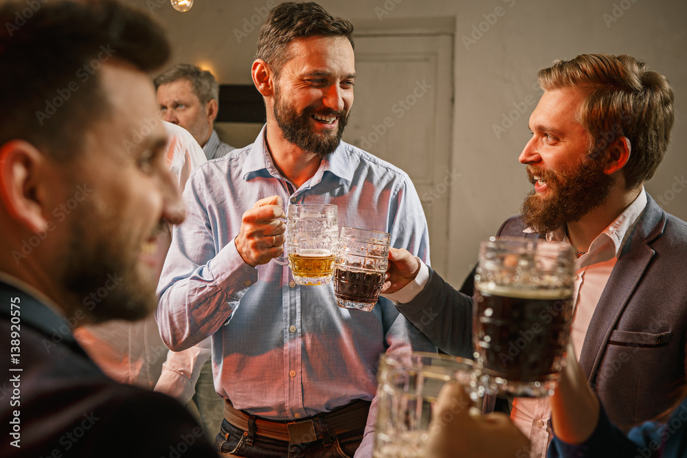 Group of friends enjoying evening drinks with beer Group of friends enjoying evening drinks with beer