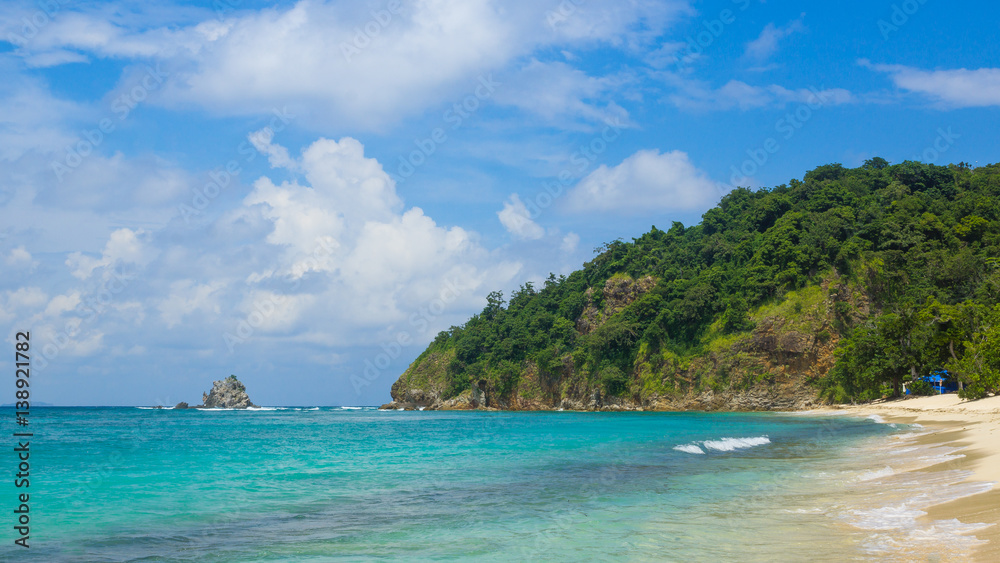Fototapeta premium Tropical Beach Scene With Rocky Island