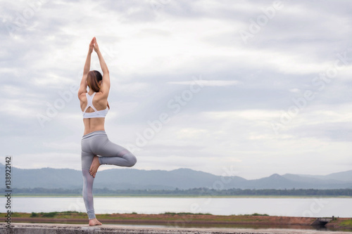 Asia woman doing yoga fitness exercise