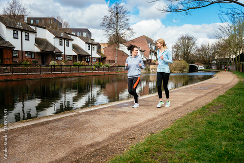 Two girls jogging outdoors in London