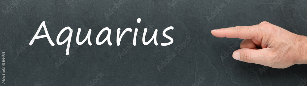 Obraz premium Aquarius on a blackboard. Zodiac signs