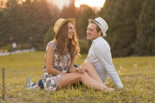 Loving and happy couple at sunset photo