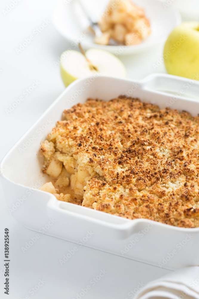apple crumble pie in white baking dish apple crumble pie in white baking dish