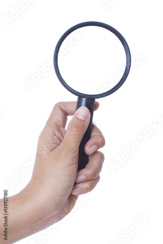 hand holding the magnifying glass isolated on white background