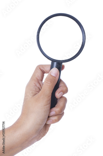 hand holding the magnifying glass on white background