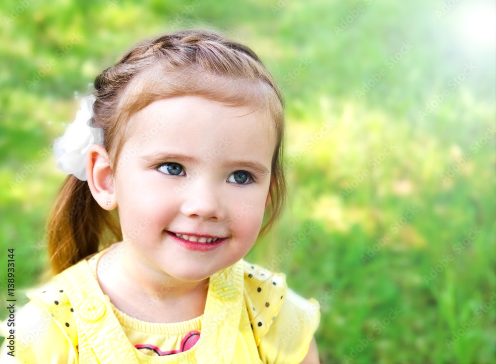 Portrait of smiling cute little girl on summer day Portrait of smiling cute little girl on summer day