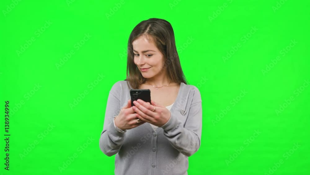 Woman receiving bad news on her phone slow motion on green screen background. Woman receiving bad news on her phone slow motion on green screen background.