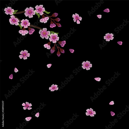 Embroidery blossoming cherry branches on a black background