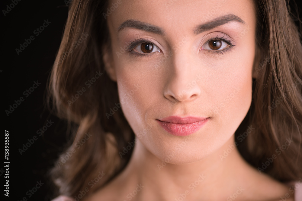 Close-up portrait of beautiful young brunette woman looking at camera Close-up portrait of beautiful young brunette woman looking at camera