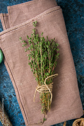 A bunch of fresh thyme on a sackcloth.