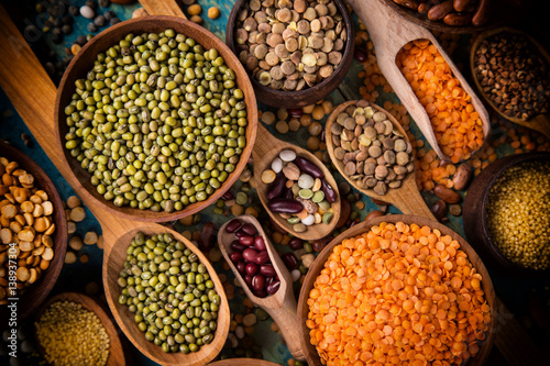 Raw legume on old rustic wooden table.