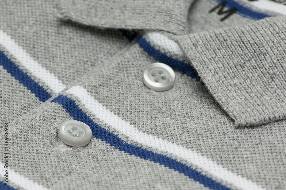 closeup t-shirt grey color and collar and buttons. shirt grey with buttons closeup closeup t-shirt grey color and collar and buttons. shirt grey with buttons closeup