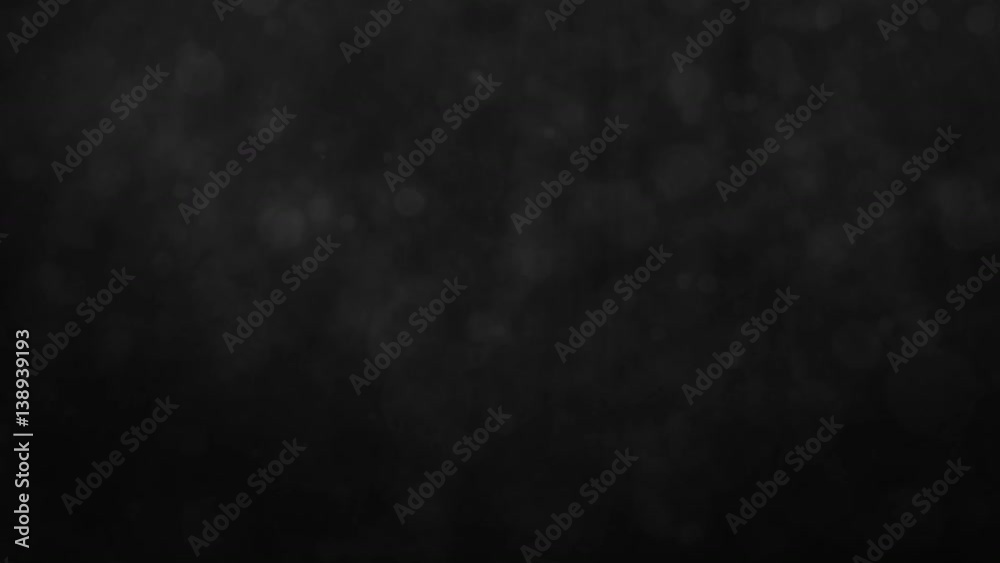 Abstract black smokey background with floating particles. Seamlessly loopable animation.