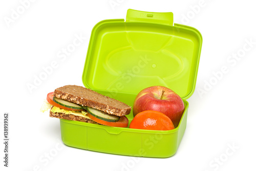 Healthy Green School Lunch Box, Isolated on White, with Whole-grain Bread and Fruit