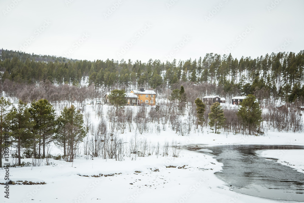 Obraz premium A beautiful wooden house in woods in Norway