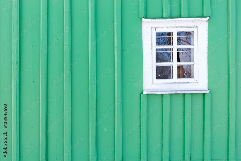 The old window of old wooden house. Background of wooden walls
