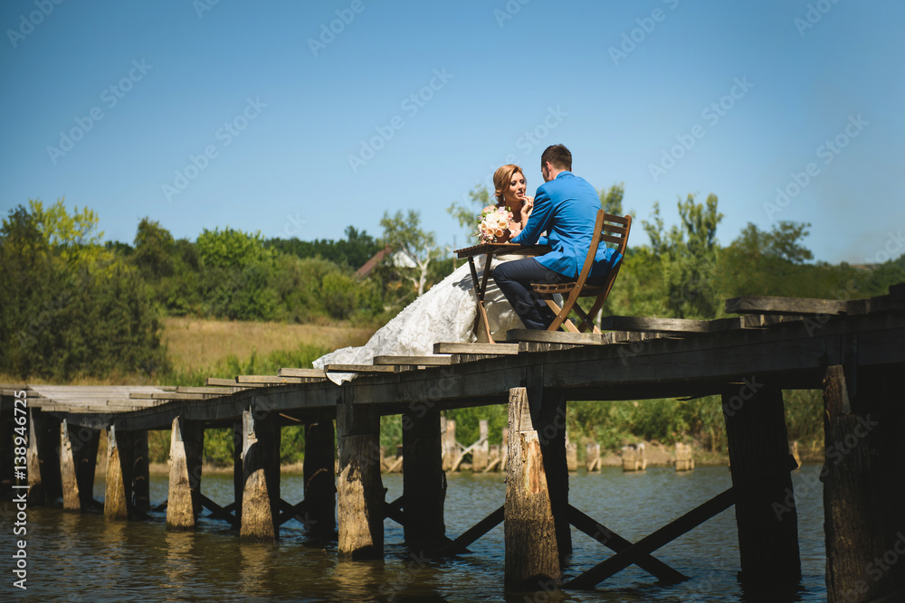 Couple at Table on Bridge Couple at Table on Bridge