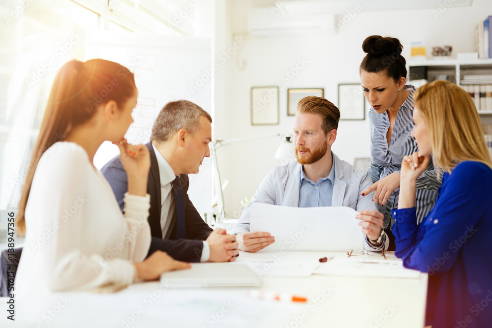 Businesspeople and architects planning Businesspeople and architects planning
