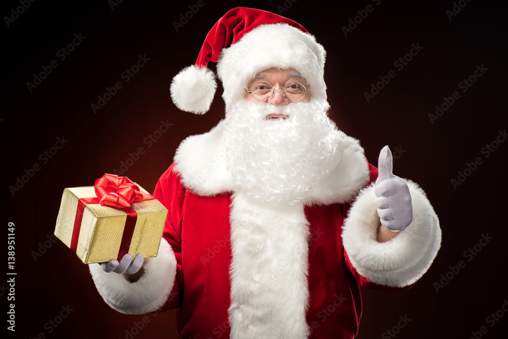 Santa Claus with gift box in hand