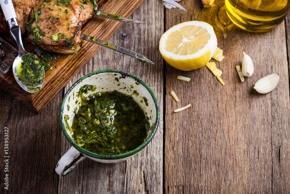 Homemade chimichurri sauce in white mug