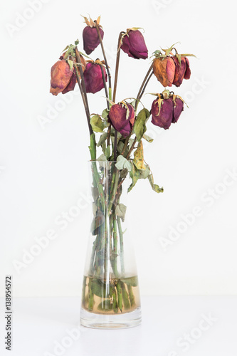 Fotografie Withered roses in vases