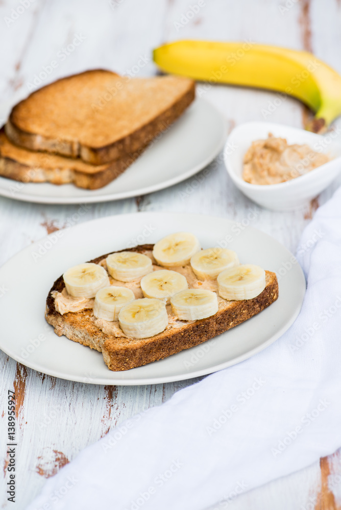 Toasts from Wholewheat Bread with Peanut Butter and Banana Toasts from Wholewheat Bread with Peanut Butter and Banana