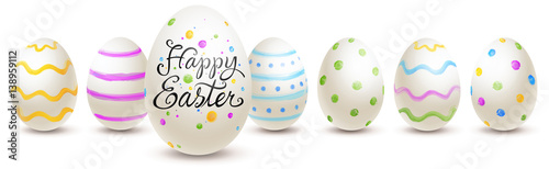Row of painted easter eggs with various patterns and lettering - happy easter