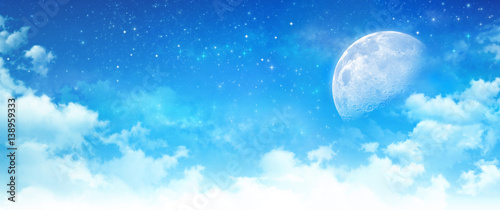 Canvas Print Moon light in a cloudy blue sky