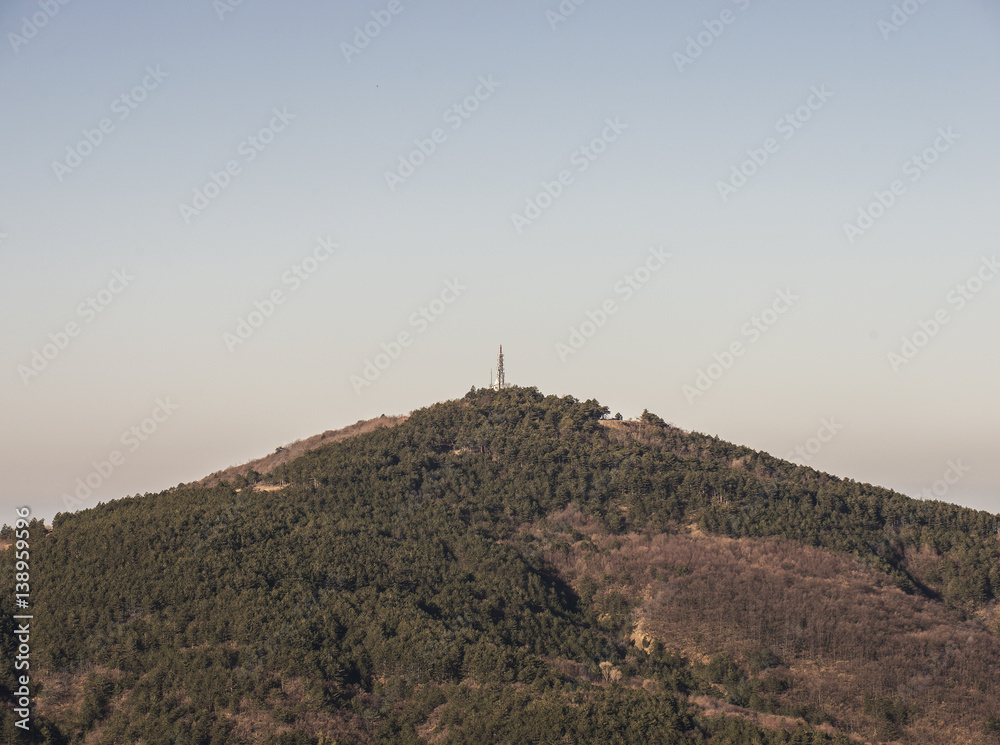 Mountain top with a telecommunication antenna
