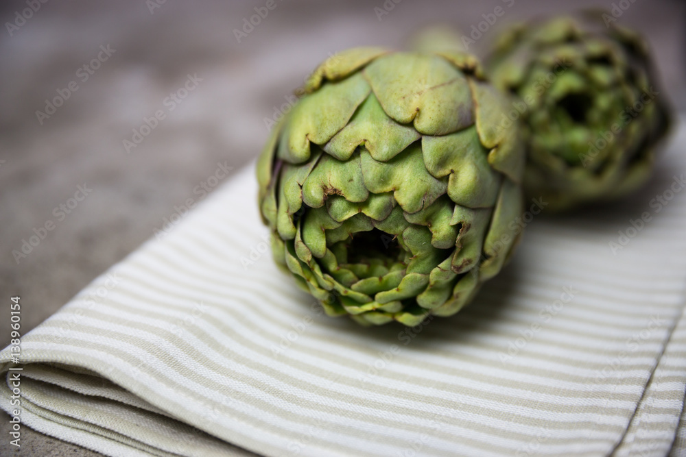Fototapeta premium artichokes on wooden board