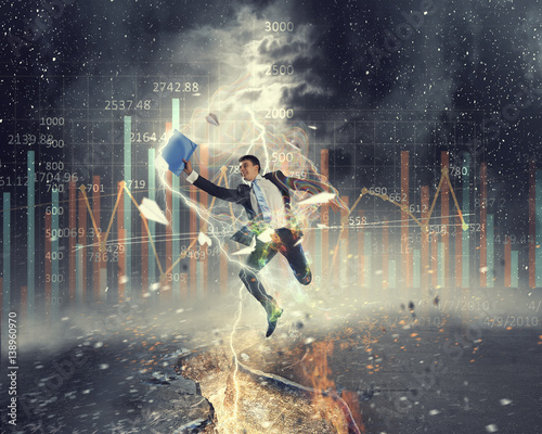 Businessman trying to overcome deep break . Mixed media