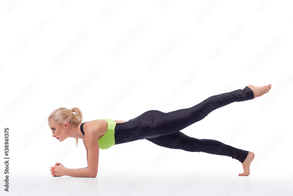 Attractive female gymnast exercising at studio Attractive female gymnast exercising at studio