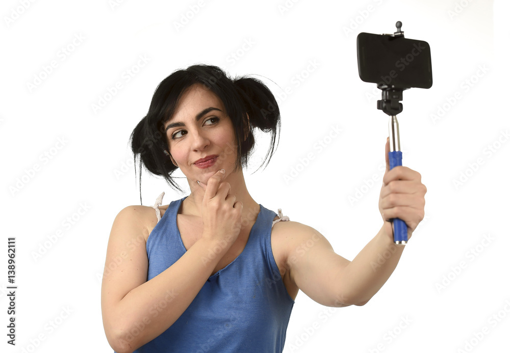 sexy woman taking selfie photo with stick and mobile phone camera posing happy sexy woman taking selfie photo with stick and mobile phone camera posing happy