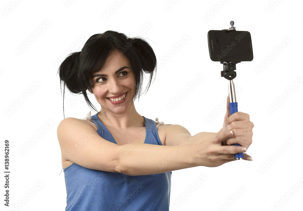 sexy woman taking selfie photo with stick and mobile phone camera posing happy sexy woman taking selfie photo with stick and mobile phone camera posing happy