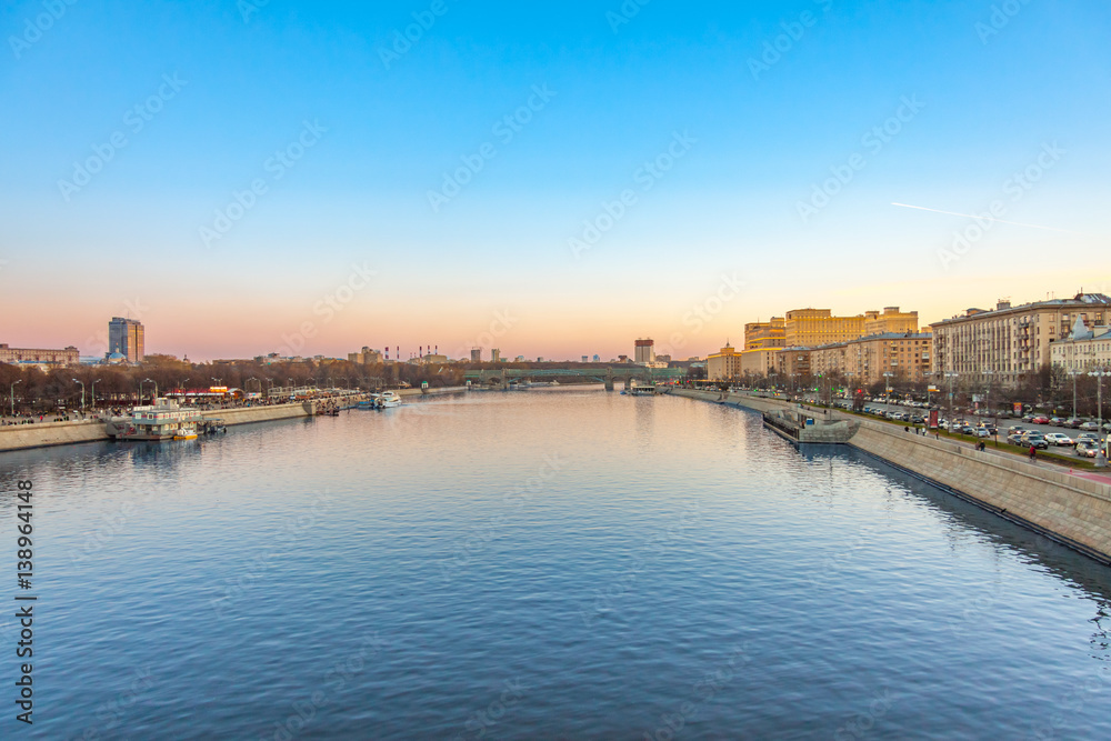 View of the Moskva river and embankments from the Crymsky bridge in autumn at sunset, Moscow landscape