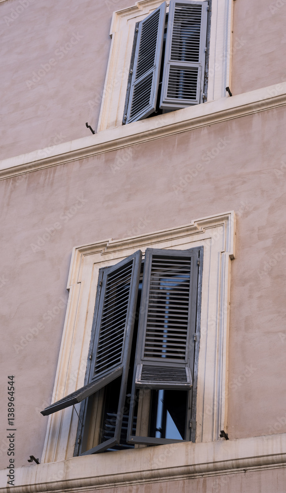 half-open window, typical jalousie in Rome, vintage architecture