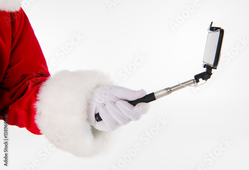 Santa Claus hand showing selfiestick photo