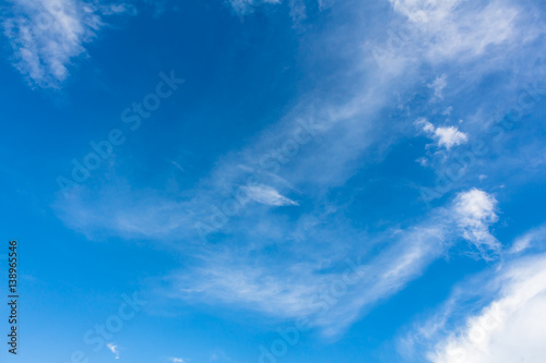 blue sky background with tiny clouds